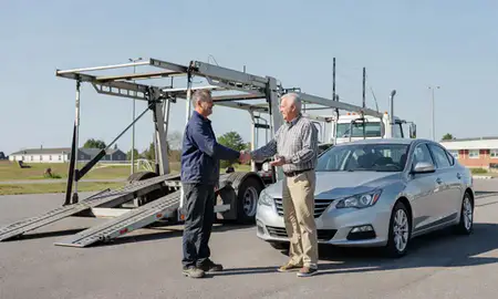 Vehicle owner beside their delivered car in East Merrimack, New Hampshire, United States
