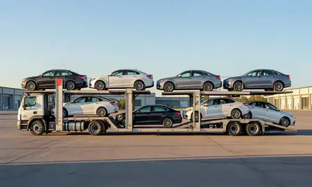 Car transporter parked in an industrial area of Franklin, New Hampshire, United States