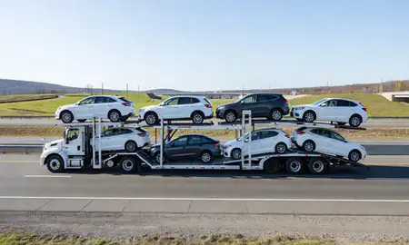Multi-level car carrier on the highway to Keene, New Hampshire, United States