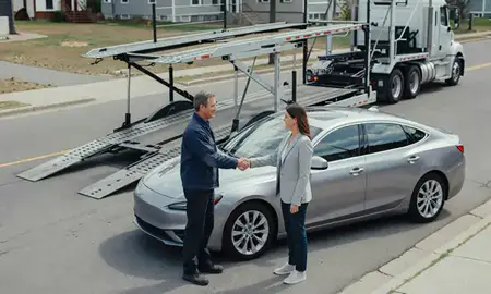 Vehicle owner beside their delivered car in Keene, New Hampshire, United States