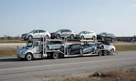 Multi-level car carrier on the highway to Klondike Corner, New Hampshire, United States