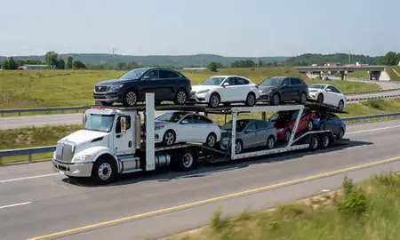 Multi-level car carrier on the highway to Lebanon, New Hampshire, United States