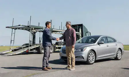 Vehicle owner beside their delivered car in Lebanon, New Hampshire, United States