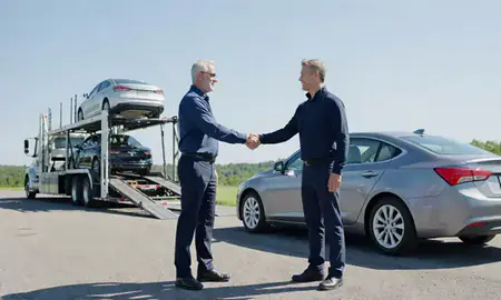 Vehicle owner beside their delivered car in Mountain Lakes, New Hampshire, United States
