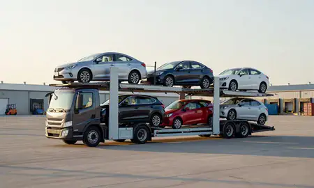 Car transporter loaded with vehicles in Mountain Lakes, New Hampshire, United States