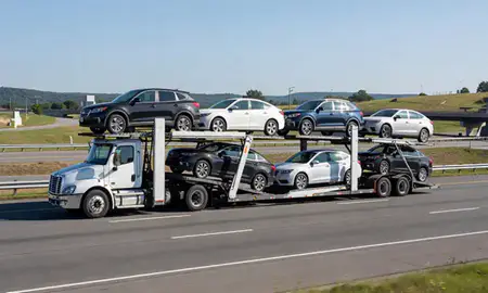 Multi-level car carrier on the highway to Nashua, New Hampshire, United States