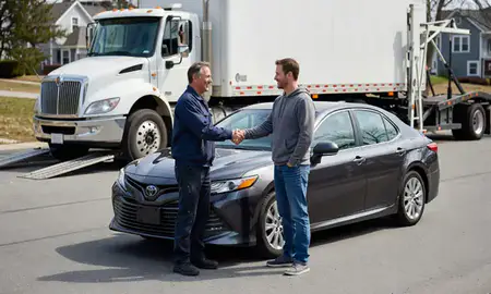 Vehicle owner beside their delivered car in Rochester, New Hampshire, United States