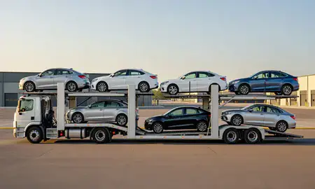 Car transporter parked in an industrial area of Sanbornville, New Hampshire, United States