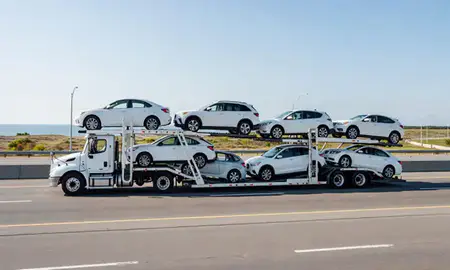 Multi-level car carrier on the highway to Seabrook Beach, New Hampshire, United States