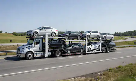 Multi-level car carrier on the highway to Somersworth, New Hampshire, United States