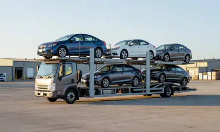 Car transporter loaded with vehicles in Somersworth, New Hampshire, United States