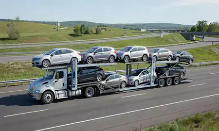 Multi-level car carrier on the highway to Tilton Northfield, New Hampshire, United States