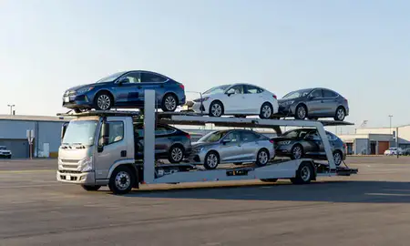 Car transporter loaded with vehicles in Tilton Northfield, New Hampshire, United States