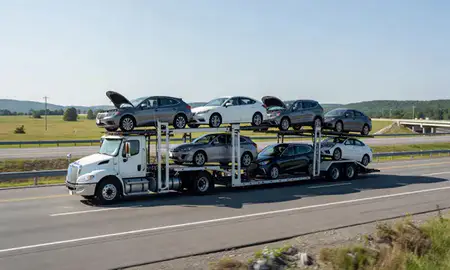 Multi-level car carrier on the highway to Woodsville, New Hampshire, United States
