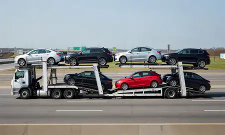 Multi-level car carrier on the highway to New Jersey, United States