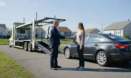 Vehicle owner beside their delivered car in New Jersey, United States