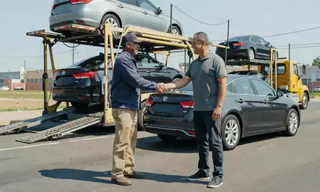 Vehicle owner beside their delivered car in Perth Amboy, New Jersey, United States