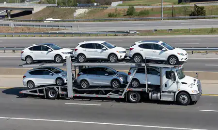 Multi-level car carrier on the highway to Plainfield, New Jersey, United States