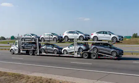 Multi-level car carrier on the highway to Princeton, New Jersey, United States