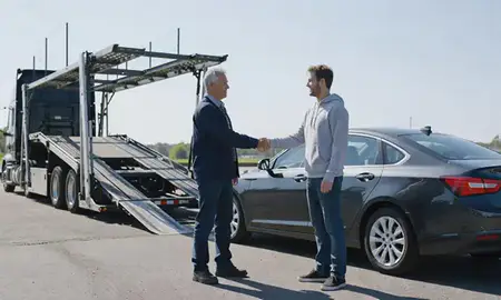 Vehicle owner beside their delivered car in Sayreville, New Jersey, United States
