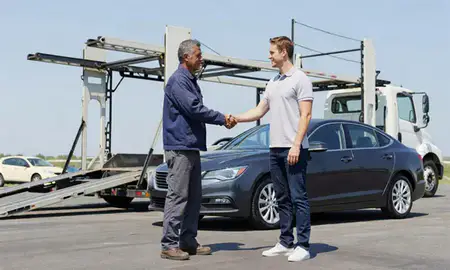 Vehicle owner beside their delivered car in West New York, New Jersey, United States