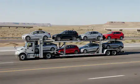Multi-level car carrier on the highway to New Mexico, United States