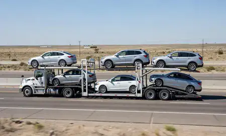 Multi-level car carrier on the highway to Artesia, New Mexico, United States