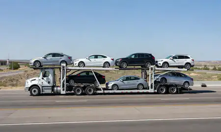 Multi-level car carrier on the highway to Carlsbad, New Mexico, United States