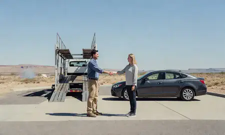 Vehicle owner beside their delivered car in Carlsbad, New Mexico, United States