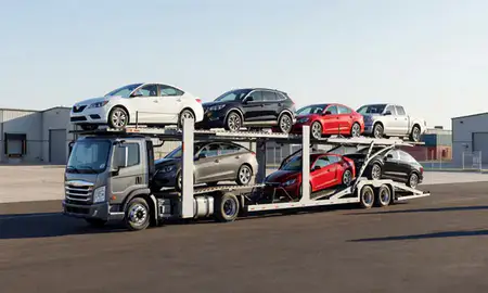 Car transporter loaded with vehicles in Chaparral, New Mexico, United States
