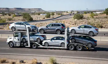 Multi-level car carrier on the highway to Española, New Mexico, United States