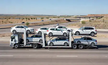 Multi-level car carrier on the highway to Las Cruces, New Mexico, United States