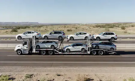 Multi-level car carrier on the highway to Las Vegas, New Mexico, United States