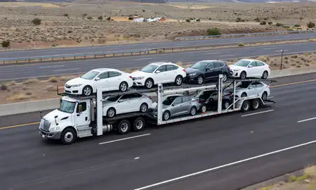 Multi-level car carrier on the highway to Los Alamos, New Mexico, United States