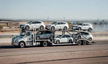 Multi-level car carrier on the highway to Los Lunas, New Mexico, United States
