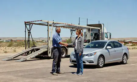 Vehicle owner beside their delivered car in Los Lunas, New Mexico, United States