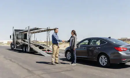 Vehicle owner beside their delivered car in Roswell, New Mexico, United States