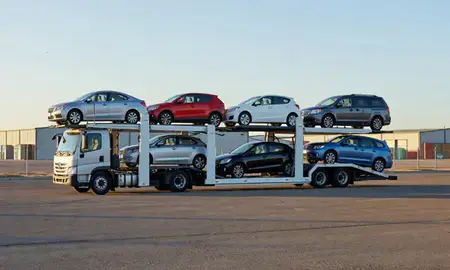 Car transporter loaded with vehicles in Santa Fe, New Mexico, United States