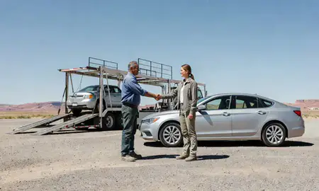 Vehicle owner beside their delivered car in Shiprock, New Mexico, United States