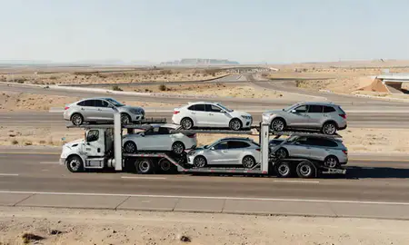 Multi-level car carrier on the highway to South Valley, New Mexico, United States