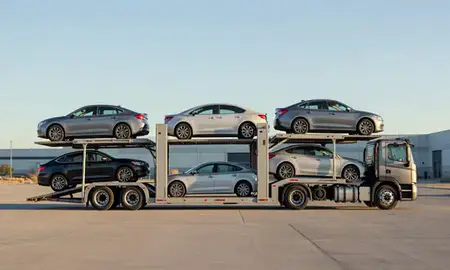 Car transporter parked in an industrial area of South Valley, New Mexico, United States