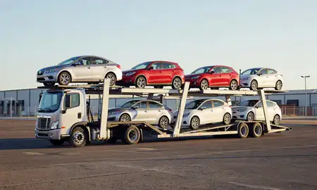 Car transporter loaded with vehicles in South Valley, New Mexico, United States