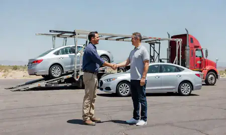 Vehicle owner beside their delivered car in Sunland Park, New Mexico, United States