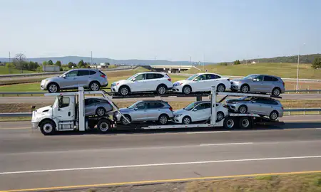 Multi-level car carrier on the highway to Albany, New York, United States
