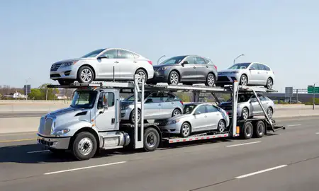 Multi-level car carrier on the highway to Bronx, New York, United States
