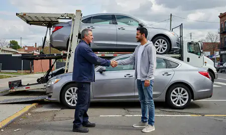 Vehicle owner beside their delivered car in Bronx, New York, United States