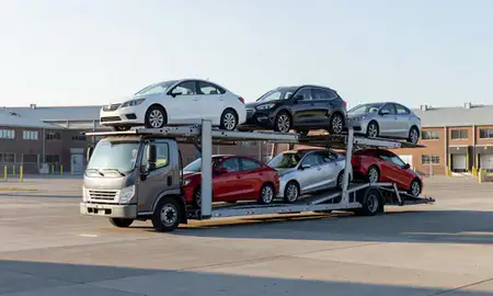 Car transporter loaded with vehicles in Bronx, New York, United States