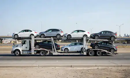 Multi-level car carrier on the highway to Brooklyn, New York, United States