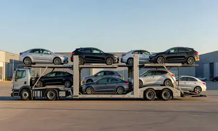Car transporter parked in an industrial area of Brooklyn, New York, United States