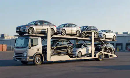 Car transporter loaded with vehicles in Brooklyn, New York, United States